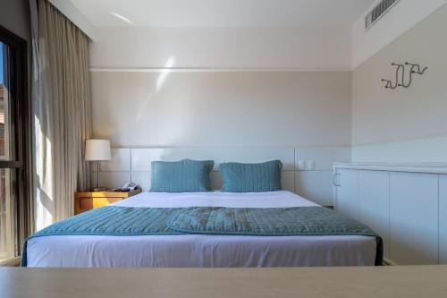 Postel nebo postele na pokoji v ubytování Estúdios Modernos em Resort pé na areia - Jurerê Beach Village JBVJR