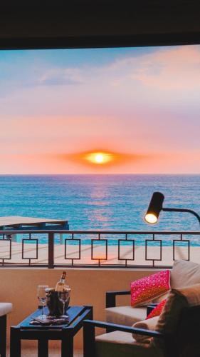 a living room with a view of the ocean at La Puesta Sayulita in Sayulita