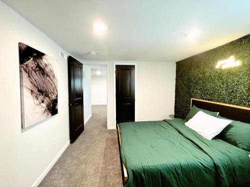 a bedroom with a green bed in a room at 1 Bed 1 Bath Basement Apartment with Private Entrance in Baltimore