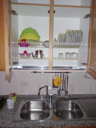 a kitchen counter with a sink in a kitchen at Geena's Home in La Spezia