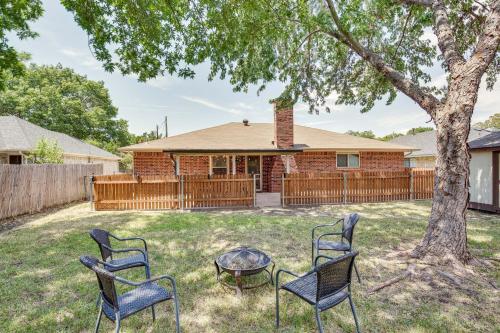 a group of chairs and a table in front of a house at Darling Waxahachie Home with Yard and Fire Pit! in Waxahachie