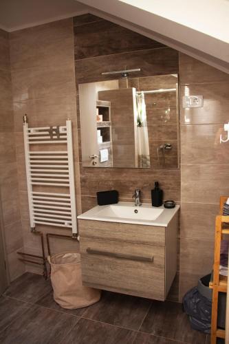 a bathroom with a sink and a mirror at Timeless in Gospić