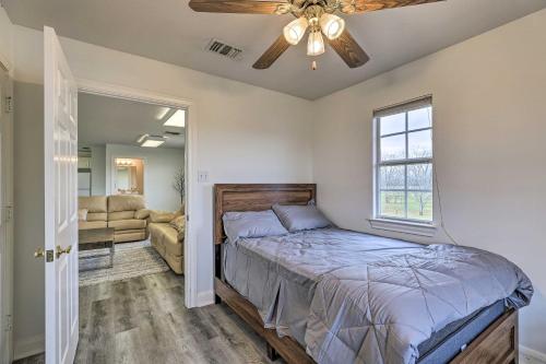 a bedroom with a bed and a ceiling fan at Fulshear Villa with Guest House and Scenic Views! in Brookshire