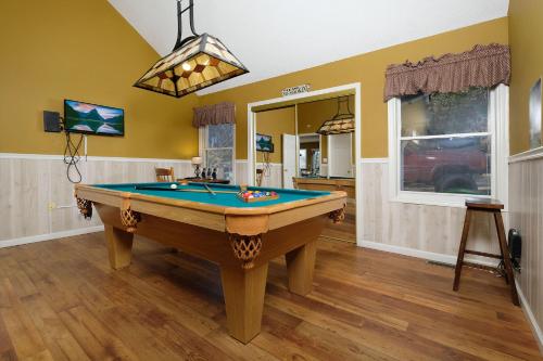 a room with a pool table in it at Bear Hugs in Gatlinburg