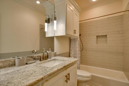 a bathroom with a sink and a toilet and a tub at Spacious Amarillo Home 6 Mi to Downtown! in Amarillo