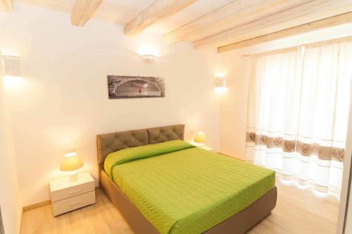 Un pat sau paturi într-o cameră la Villa Sant'anna