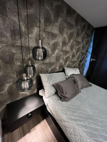 Ένα ή περισσότερα κρεβάτια σε δωμάτιο στο Urban Plaza Business Apartment