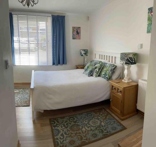 Кровать или кровати в номере Bournemouth Cosy Retreat