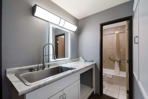 a bathroom with a sink and a mirror at Best Western Bemidji in Bemidji
