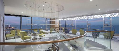 a dining room with a view of the ocean at Hilton Istanbul Bakirkoy in Istanbul