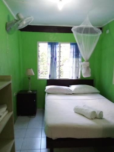 Postel nebo postele na pokoji v ubytování Island Home