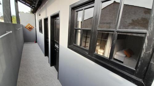 a hallway with a large window in a building at Flat In Paraty in Paraty