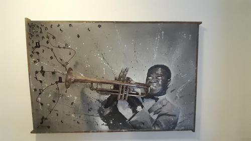 a picture of a man playing a trumpet at Flat In Paraty in Paraty