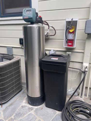 a water heater and a trash can next to a wall at Upscale Downtown Home Walk to Beach shops Bars 2 in Santa Barbara