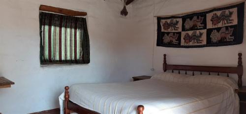 Ένα ή περισσότερα κρεβάτια σε δωμάτιο στο El Sol Hostel de Humahuaca