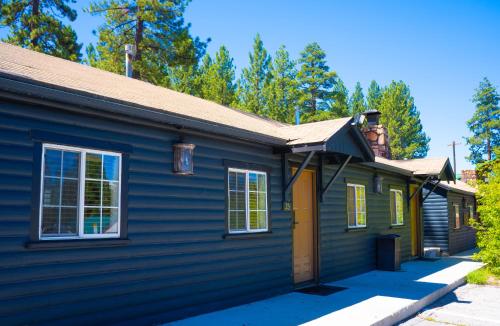 a house with blue siding and a roof at Sessions Retreat & Hotel in Big Bear Lake