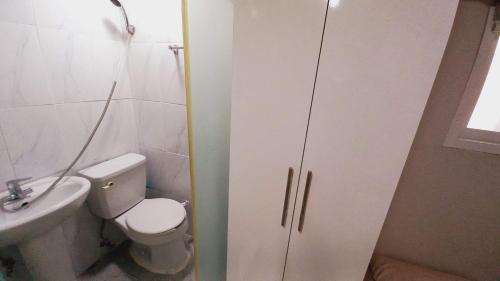 a bathroom with a white toilet and a sink at Haechi Stay GuestHouse - For foreigners only in Seoul