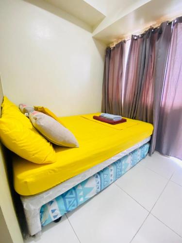 Postel nebo postele na pokoji v ubytování Wind Residences Apt. 1506 Tagaytay