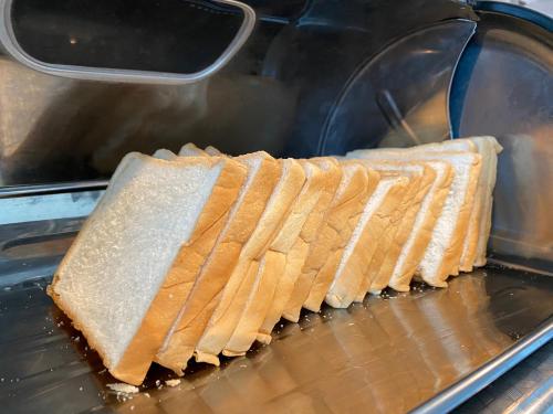 two slices of bread being cooked in a toaster oven at Don Muang Hotel in Bangkok