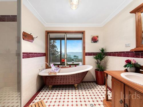 a bathroom with a tub and a window at Mount Baker Retreat - Entire Home in Mount View