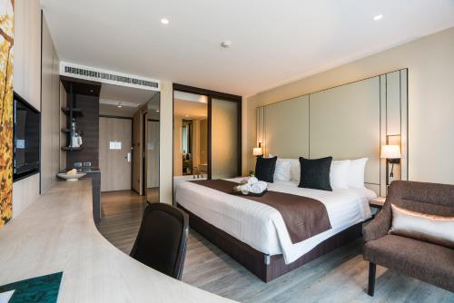 Postelja oz. postelje v sobi nastanitve The Siamese Hotel by PCL