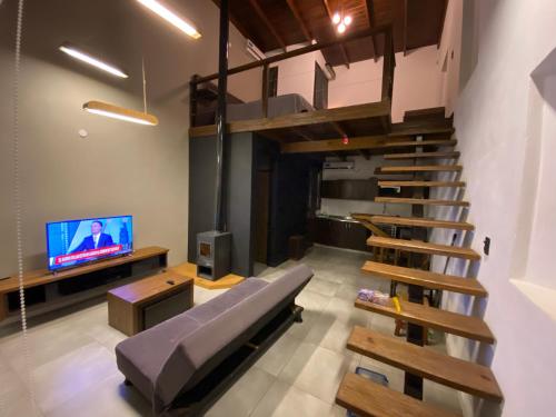 TV a/nebo společenská místnost v ubytování Loft de Montaña