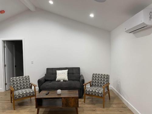 a living room with a couch and two chairs at Gated private house with own parking Sherman Oaks in Los Angeles