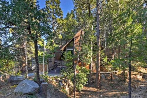 a log cabin in the woods with trees at Arrowhead Lake Cabin pool table stunning views in Lake Arrowhead