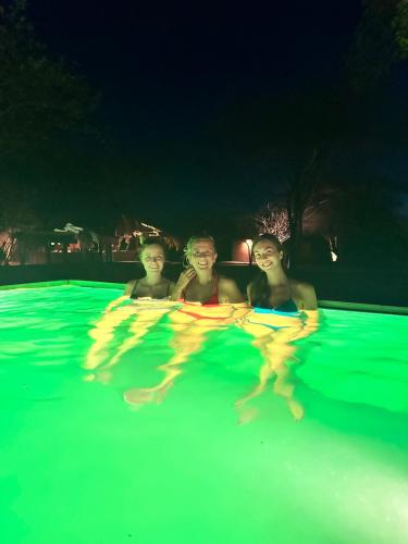 a group of people in a swimming pool at night at Yakaduru - Yala in Yala