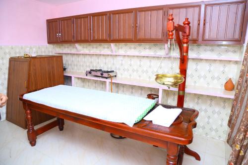 Kuchyň nebo kuchyňský kout v ubytování ASHRAMAM HEALTH RESORT