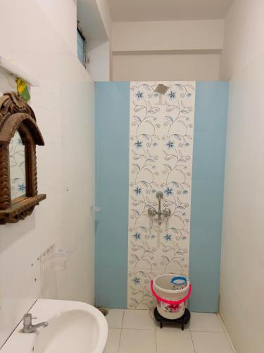 a bathroom with a sink and a toilet at Hotstel Udaipur in Udaipur
