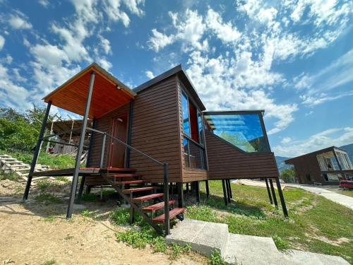 a tiny house on display on the side of a street at Nika Hotel and Club in Chʼanchʼkhalo