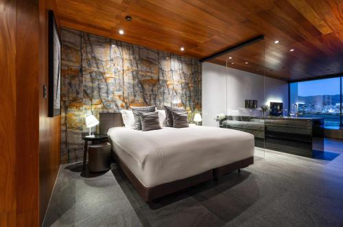 Postel nebo postele na pokoji v ubytování Kamo Residences by Reflections