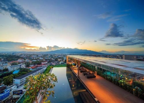 a view of a city from a building at The Astra cozy living suite in Chiang Mai
