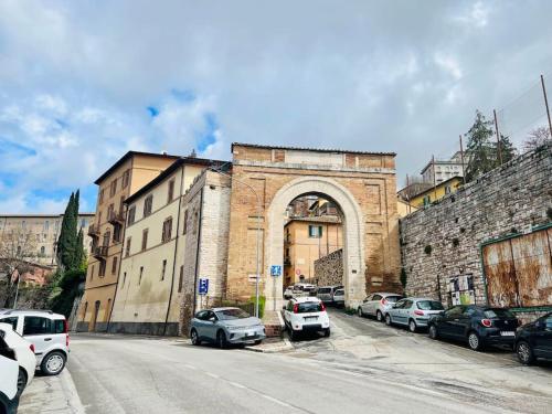 a large building with cars parked in front of it at Loft Eburnea 13 in Perugia