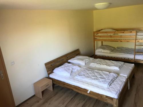 Postel nebo postele na pokoji v ubytování zum Sanddorn