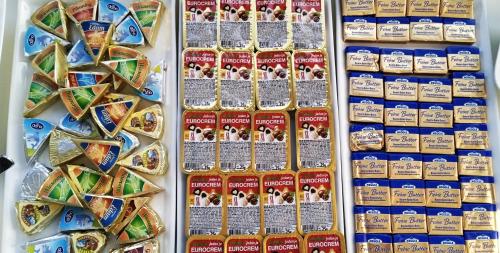 a store display of cheese and other food items at City Boutique Hotel in Sarajevo