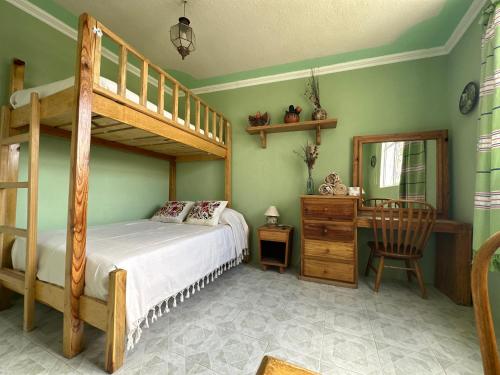 Postel nebo postele na pokoji v ubytování Casa Tecolote