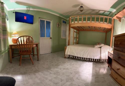Postel nebo postele na pokoji v ubytování Casa Tecolote