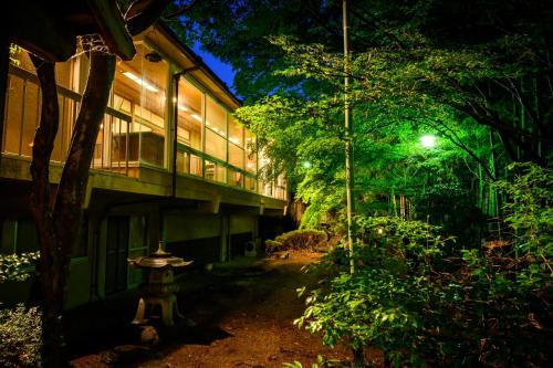 a building at night with a fire hydrant in front of it at 円山山荘 Maruyama villa 自然と調和し和の美を感じる岡山市内屈指の豪邸宿 supported by COCOSTAY in Okayama
