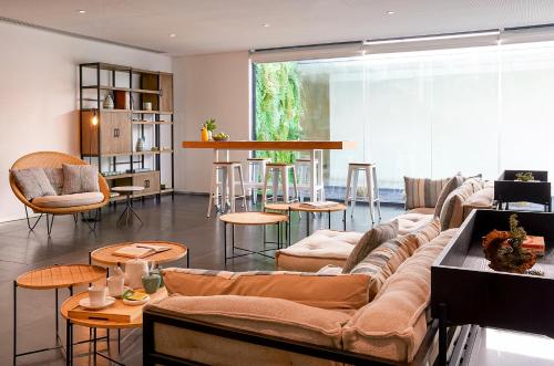 a living room with a couch and a table at Octant Santiago in Santiago do Cacém