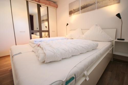 Voodi või voodid majutusasutuse Am Brandungsbad App 3 5 inkl WLAN toas