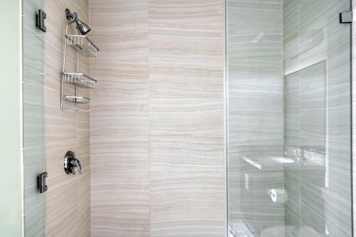 a bathroom with a shower with a glass door at Palo Alto 2BR w WD Pool Spa nr Pinterest SFO-942 in Palo Alto