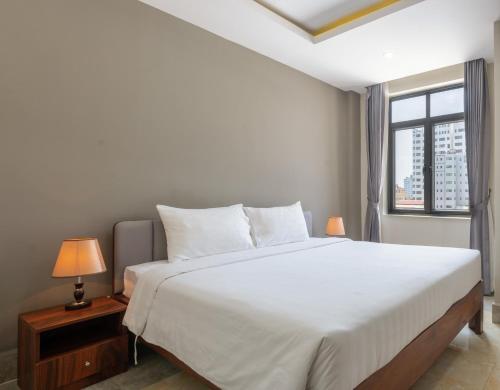 Un pat sau paturi într-o cameră la SOHO Residence