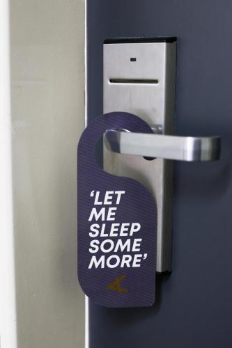 a sign that says let me sleep some more at Aleph Boutique Hotel in Jbeil