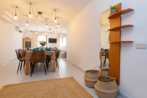 a dining room with a table and chairs at 21 Sleeps Private Pool Villa & BBQ Near Barcelona in Rocafort