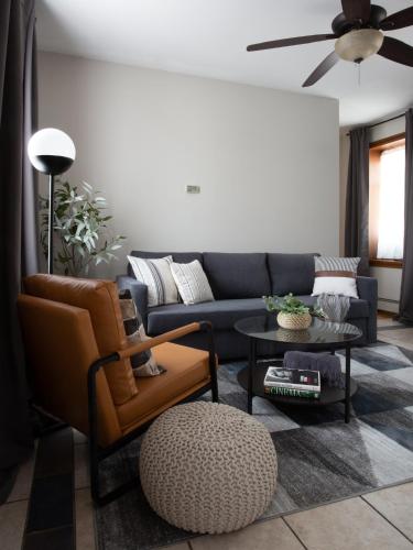 a living room with a couch and a table at Spacious Stay near Yale in Downtown New Haven in New Haven
