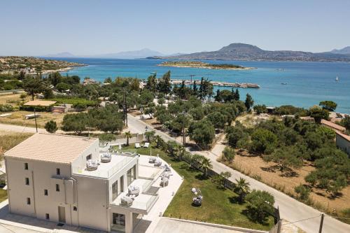 an aerial view of a white building and the ocean at Villa Palena in Chania