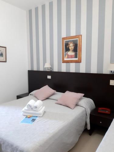 Postel nebo postele na pokoji v ubytování Hotel Ancore