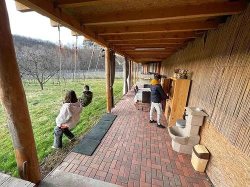 a group of people standing outside of a building at Grandpa's House in Hateg in Haţeg